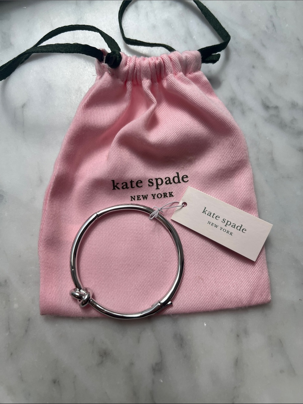 kate spade Silver Knot Bangle with Pink Drawstring Pouch